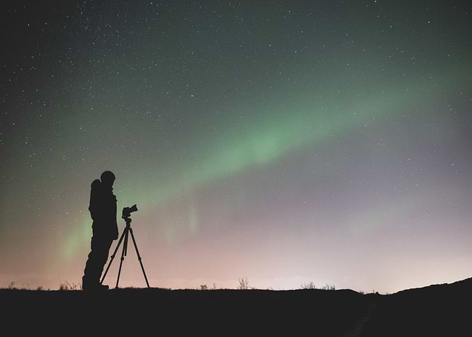 people iceland aurora
