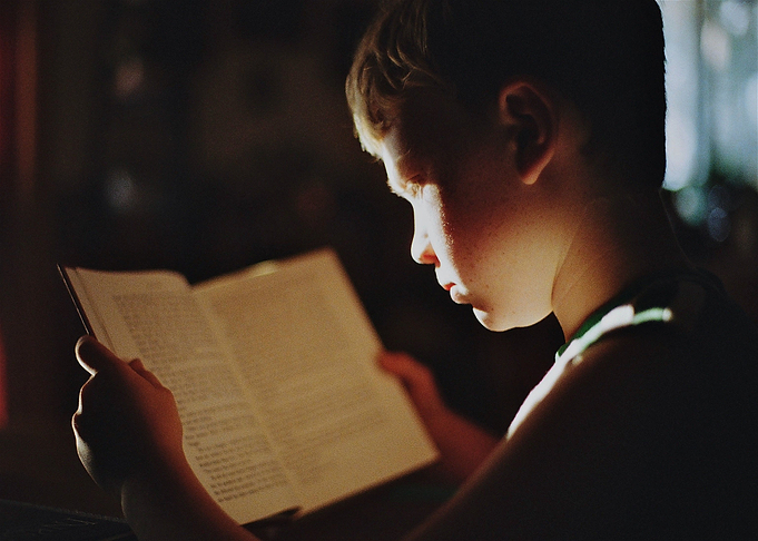 boy child ridding book