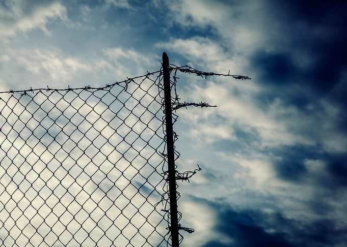 Fence torn hopeless