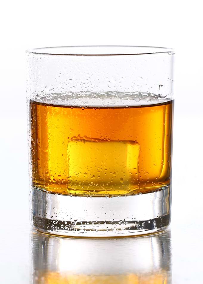 Gold whiskey on the rocks