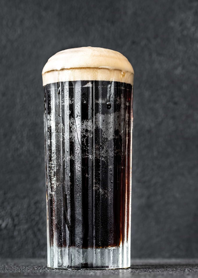 Glass of black velvet cock