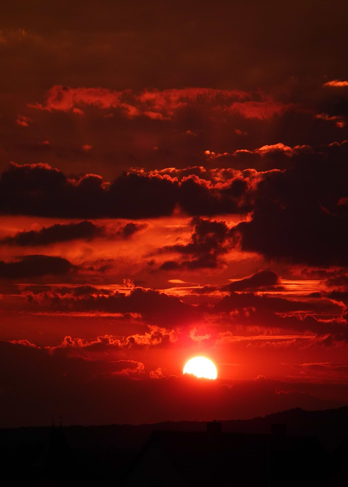 red sun cloud black