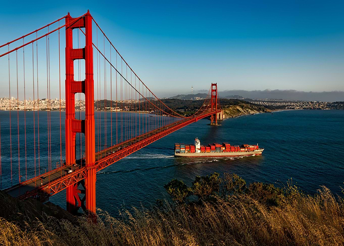 red bridge boat under beac