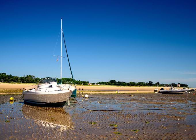 boats laying on the beach