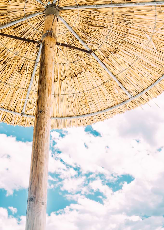 Straw Parasol Against Sky