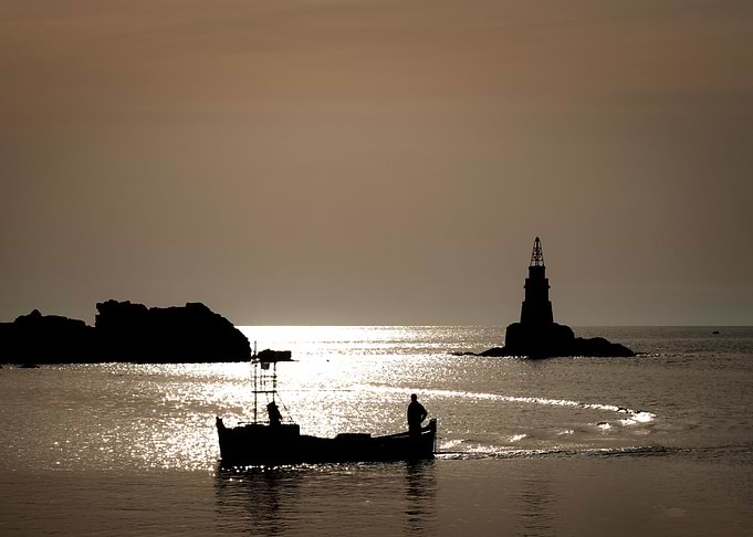 Fisherman at the sunrise