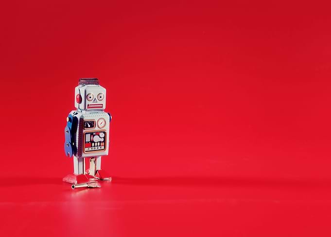 Tin toy robot solitary red