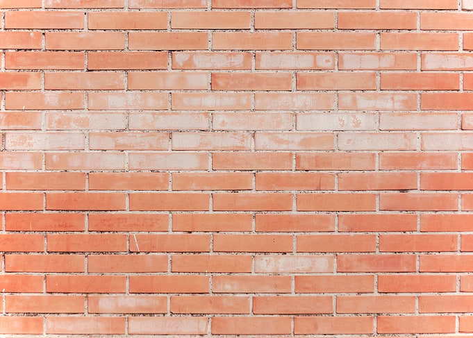 Wall red bricks worn flat