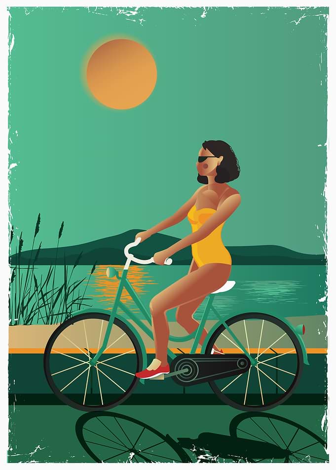 Cyclist on lake shore path