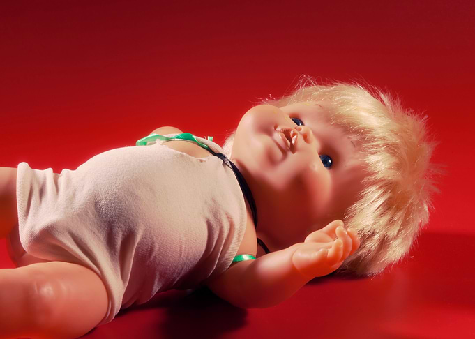 Doll ominous lying angled