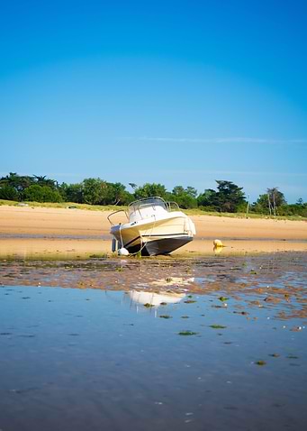 boat laying on the beach