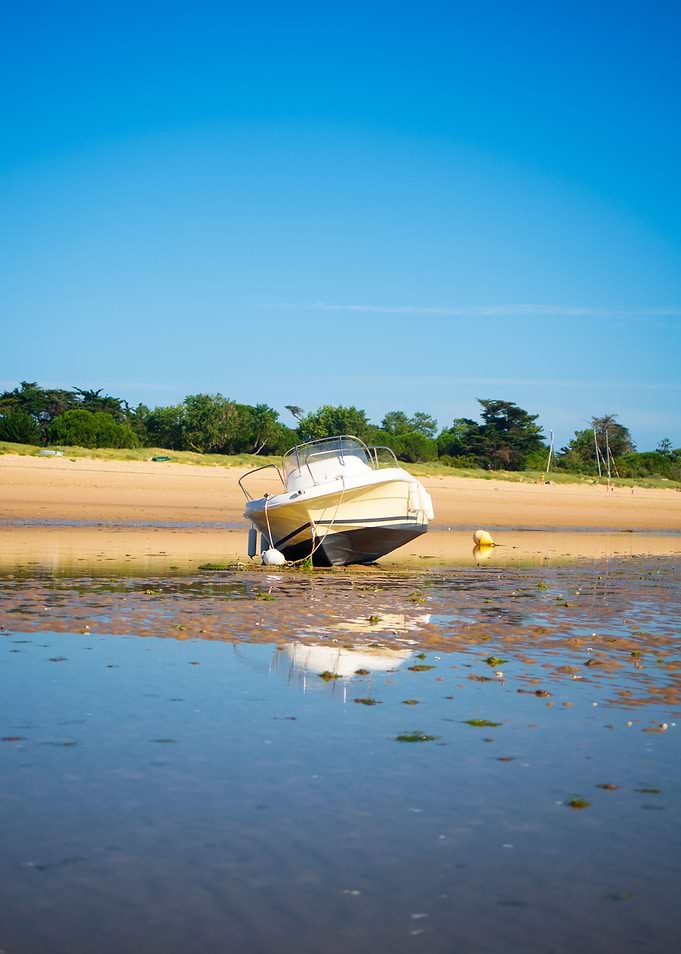 boat laying on the beach