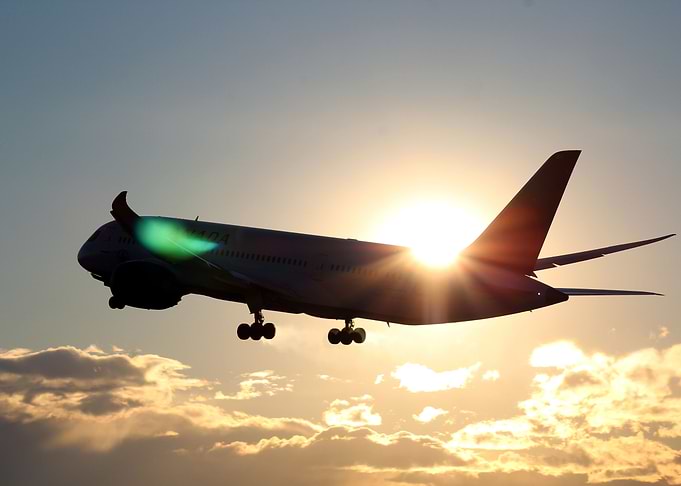 Boeing 787 takeoff sunset