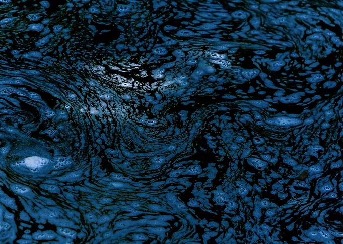 Foam in blue water