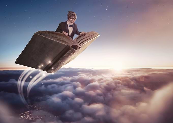 Man Flying In A Book