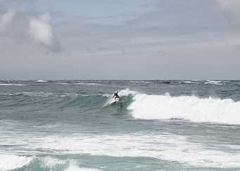 Surfer Riding the Wave 1