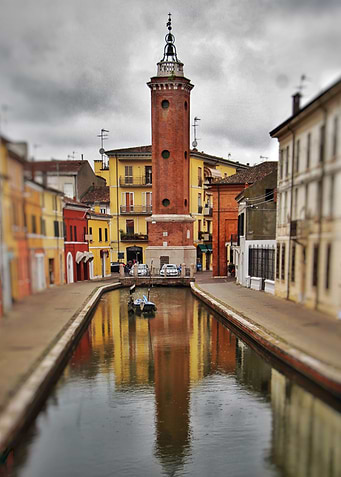 Tower at canal in Italy