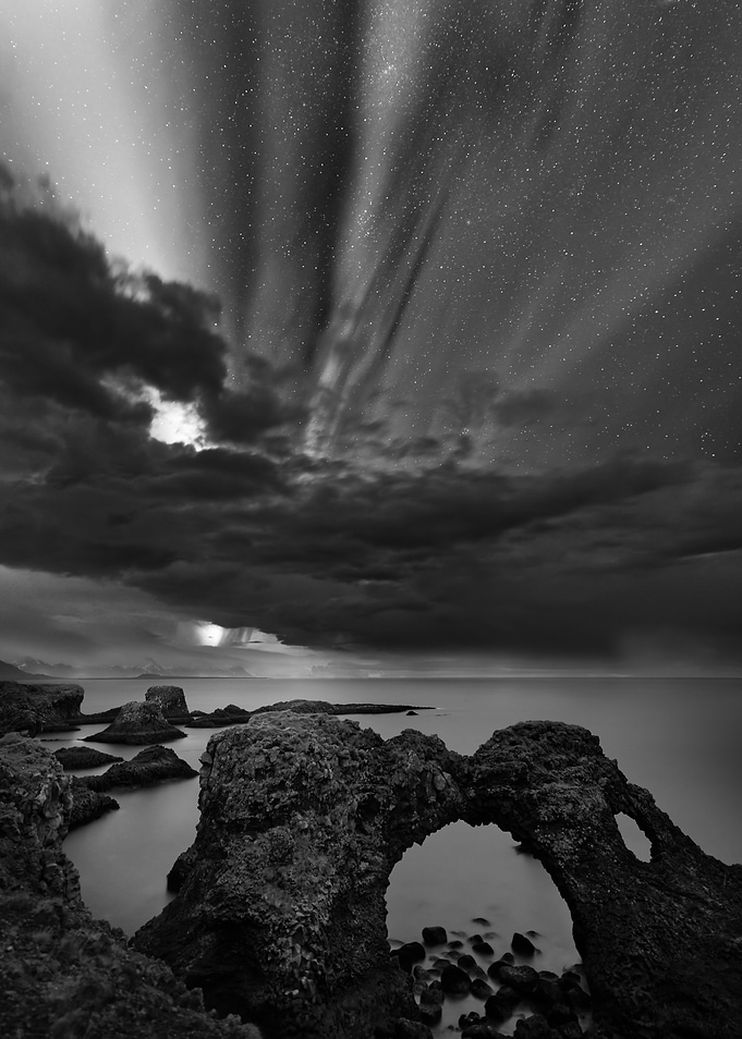Aurora over a arch of rock