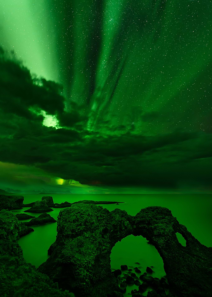 Aurora over a arch of rock