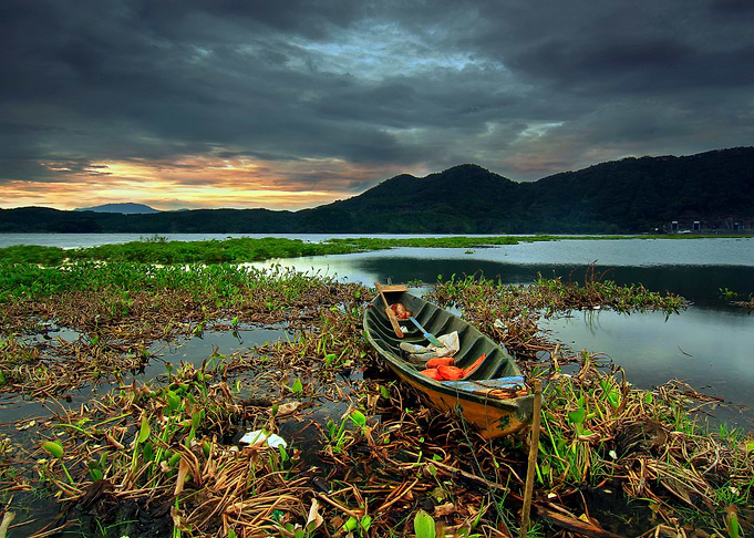 Boat at Lake by Mountains