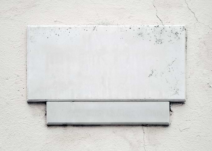 Marble sign on street wall