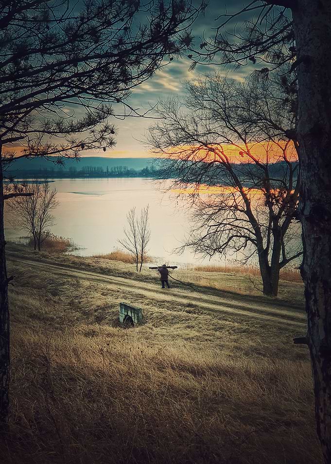 Person walking at sunset