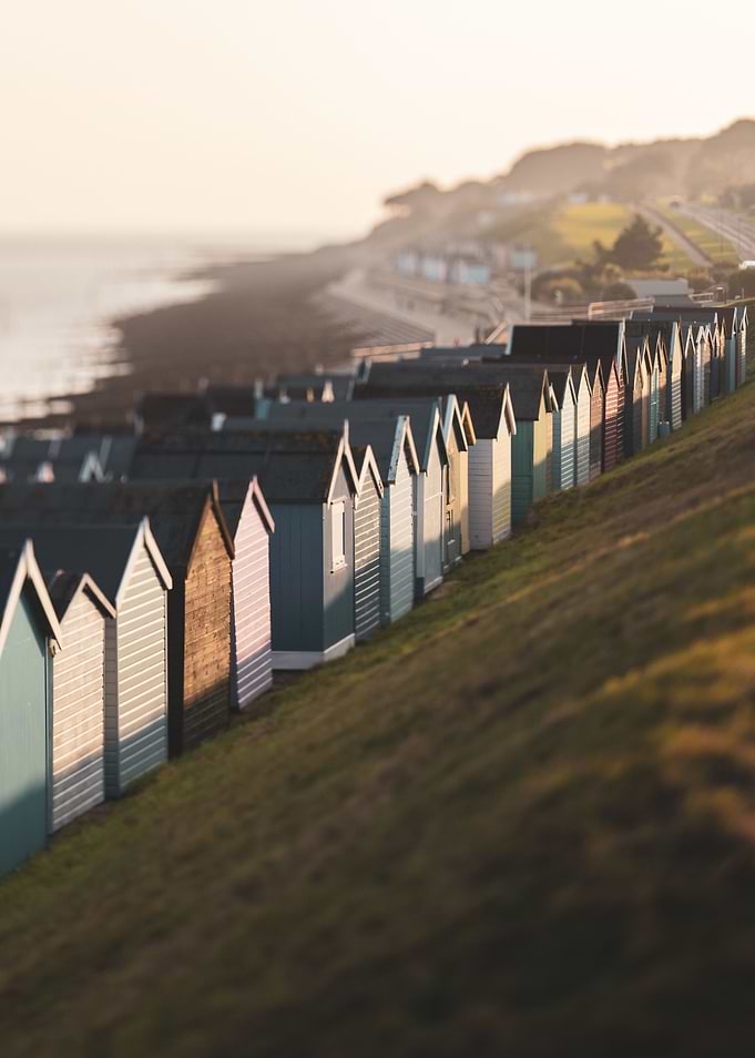 Beach huts in sunset