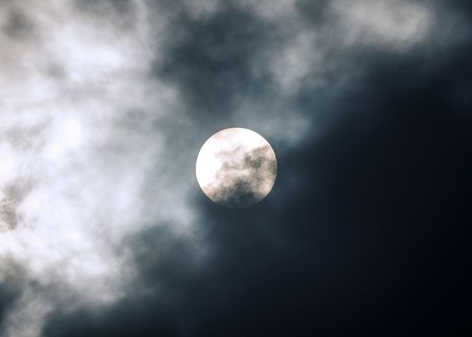 Sun behind the clouds