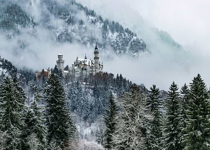 Castle and foggy mountains