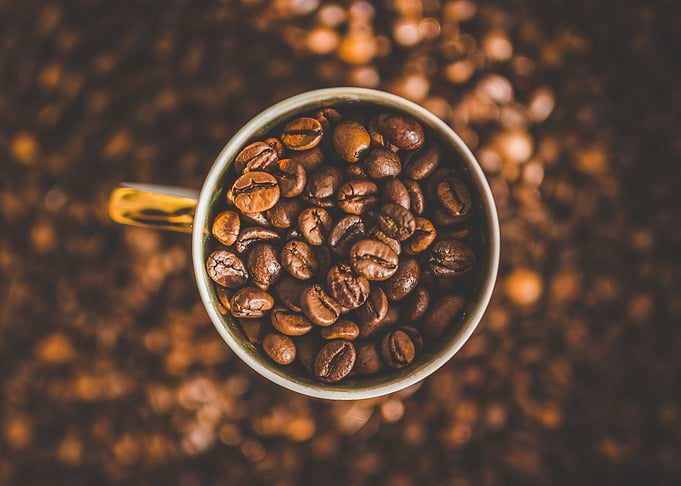 Coffee Beans in Golden Mug