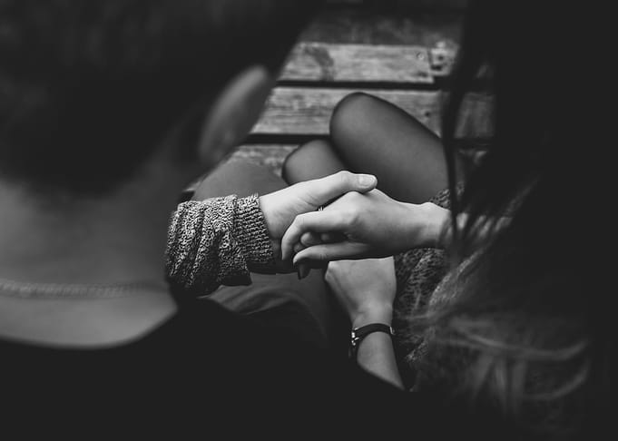 Couple holding hands