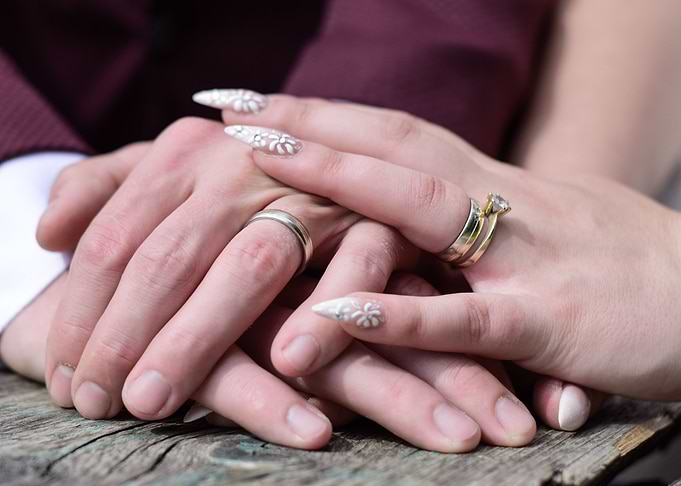 Newly Weds holding hands