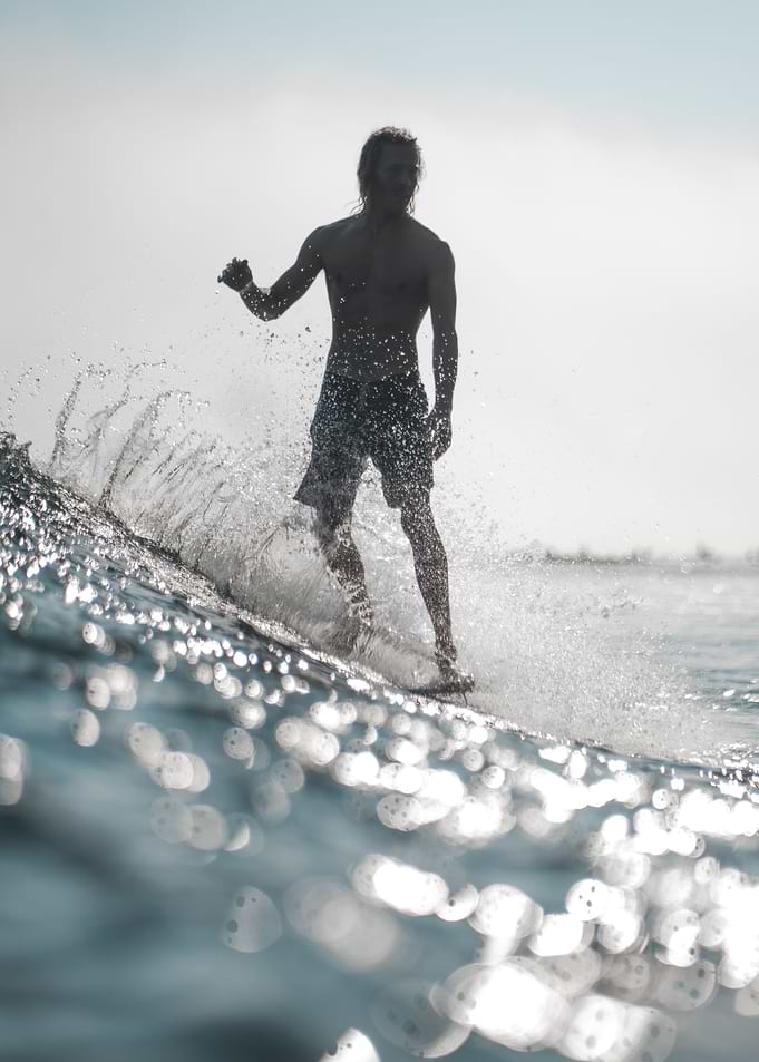 Surfboarder standing up