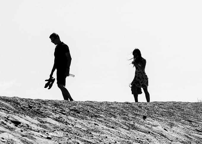 Couple Walking On The Sand