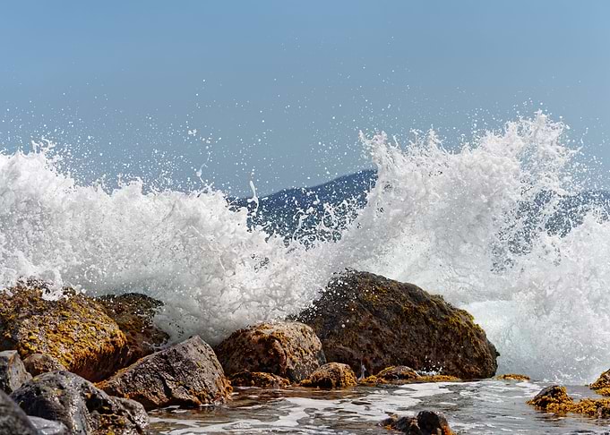 trong surf over stones
