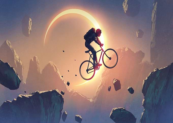 cyclist crossing a cliff