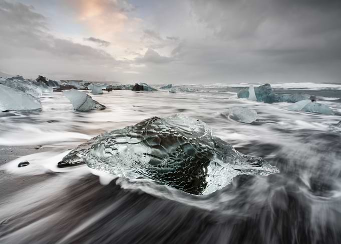Ice block on black beach
