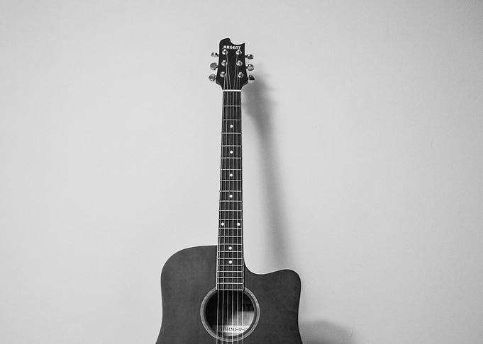 Acoustic Guitar leaning