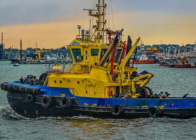 Tugboat sailing at river
