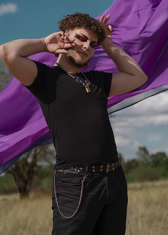 Behind a Purple sash