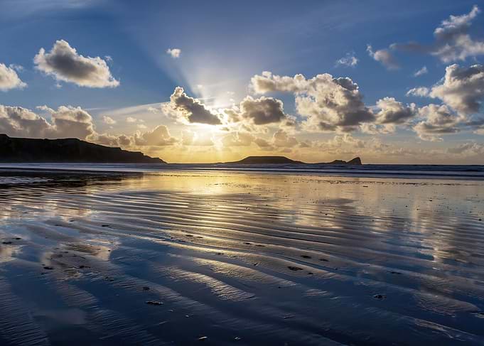 Wet sand at sunset