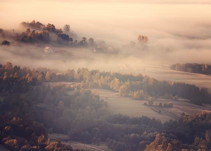 Misty sunrise in mountains