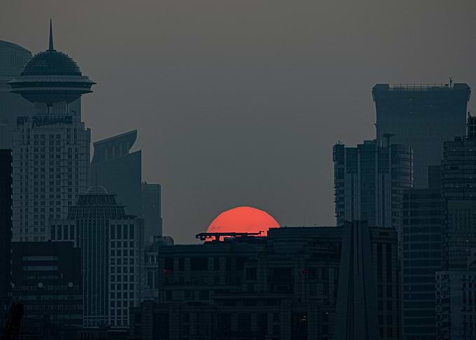 Moon rise over city