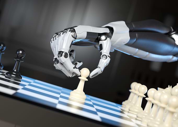 Robots hand moving a pawn