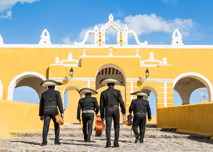 Mariachi musicians walking