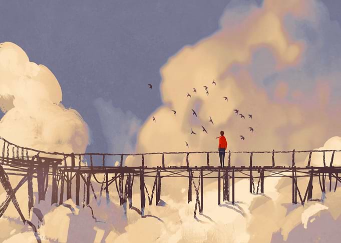 Man standing on bridge