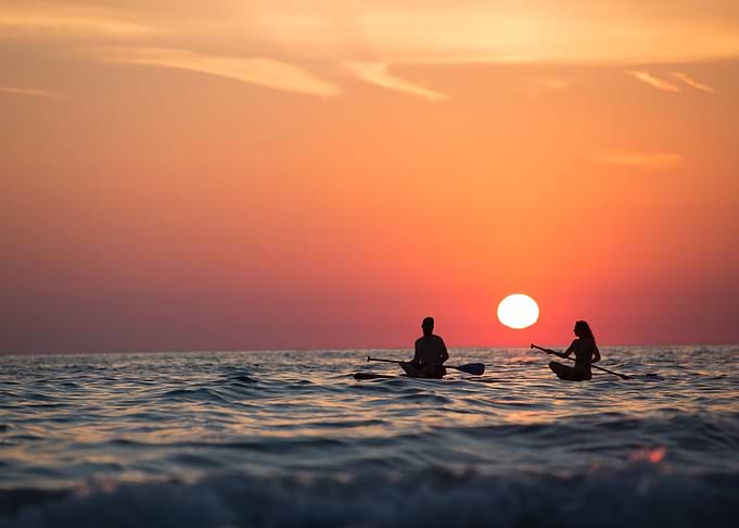 Two Canoeists at Sunset