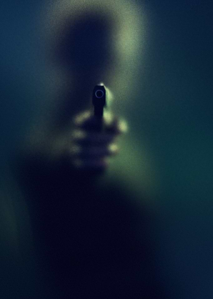 Gun behind frosted glass