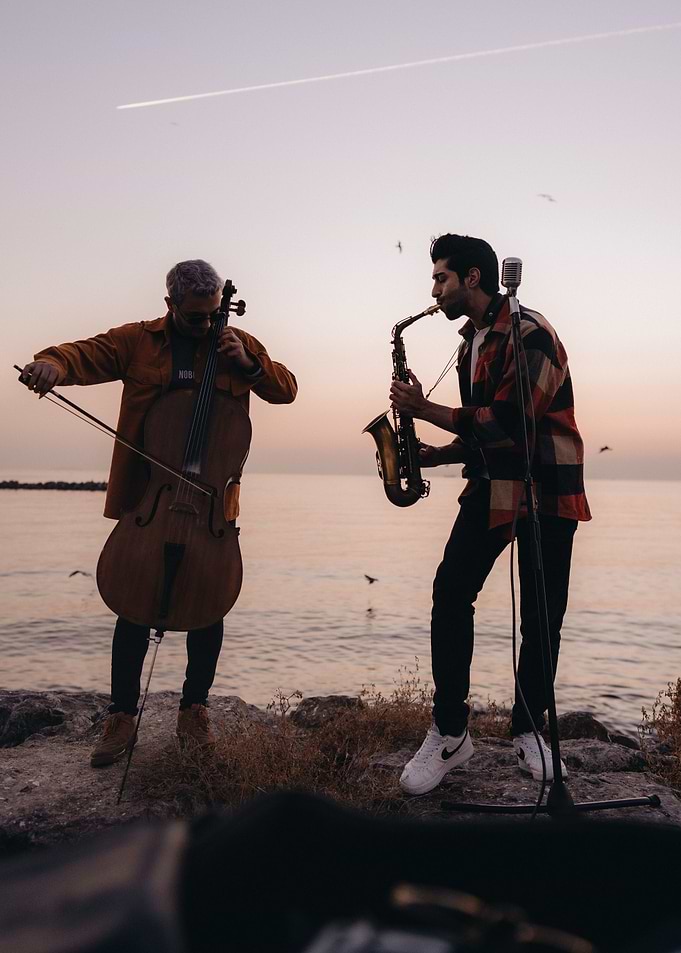Musicians on a cliff