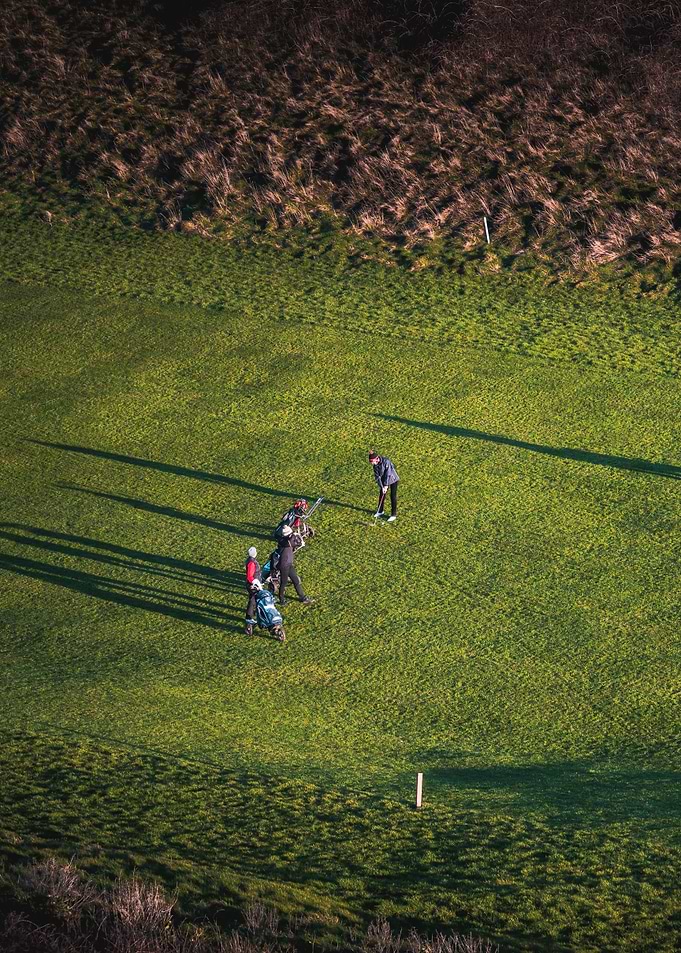 Golfer under sunset